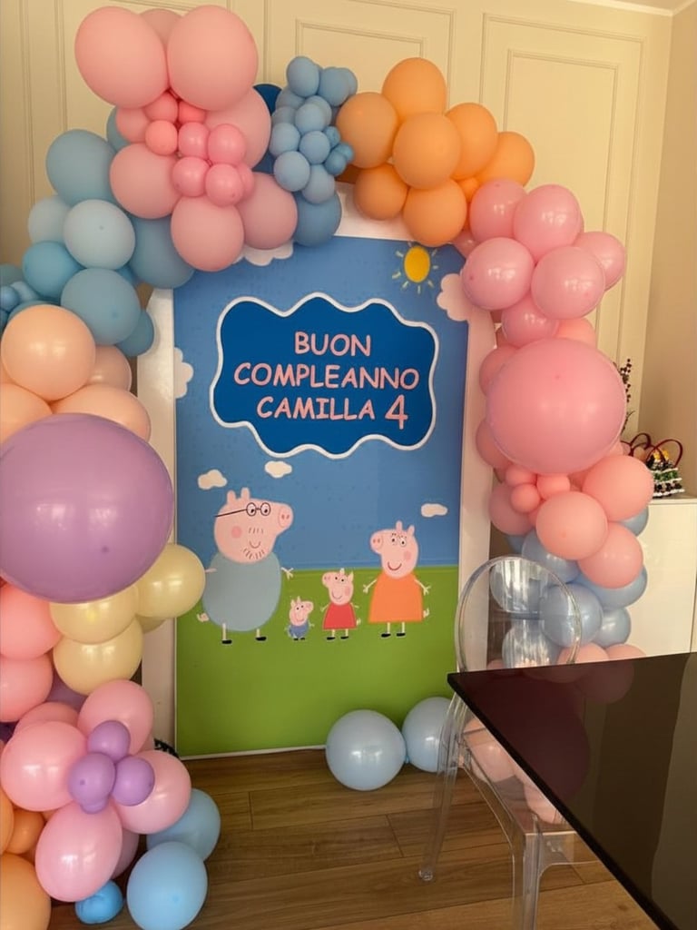 Colorful birthday party backdrop with Peppa Pig characters surrounded by pink, blue, orange, and purple balloons